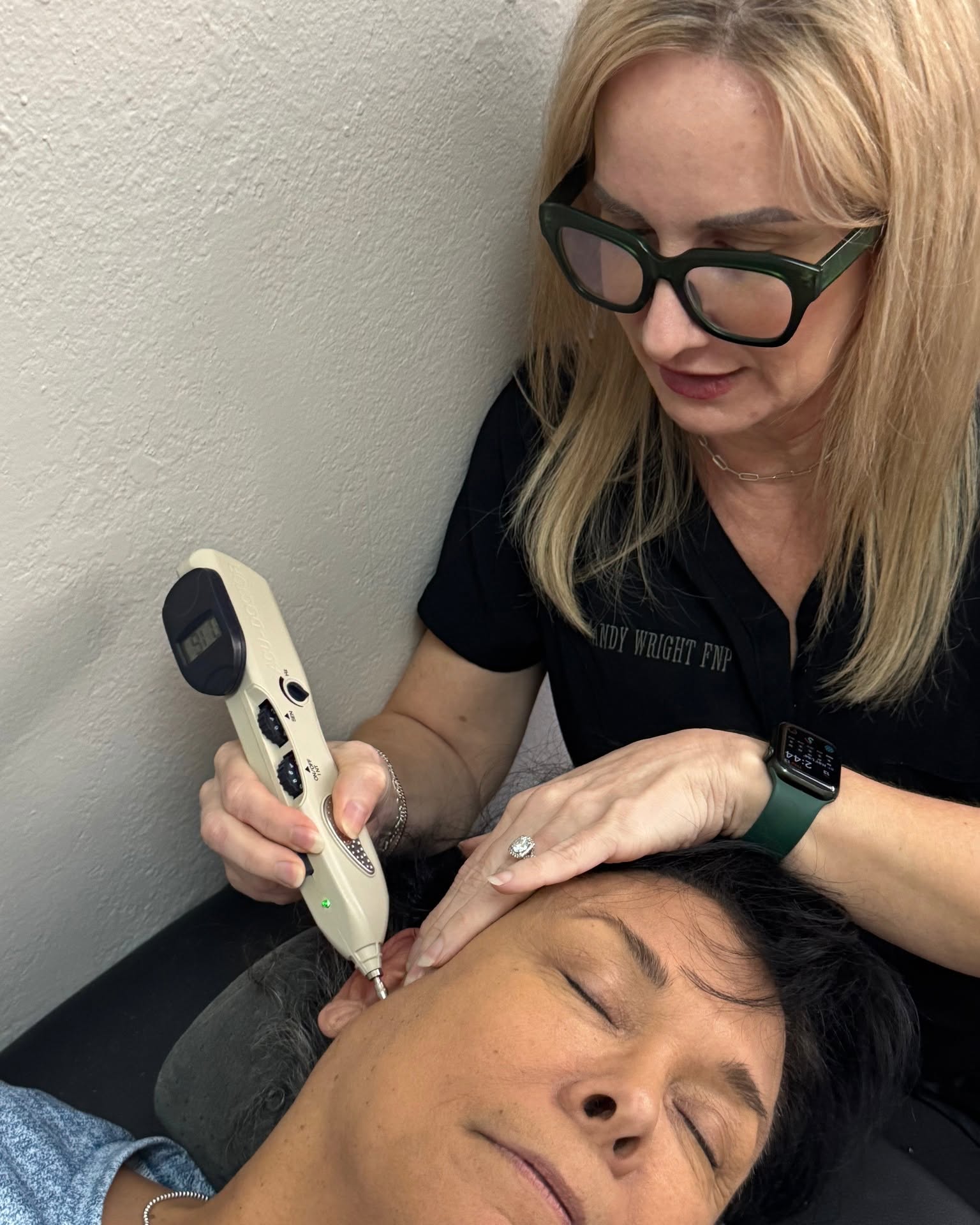Mandy Wright performing auriculotherapy with gentle ear point stimulation